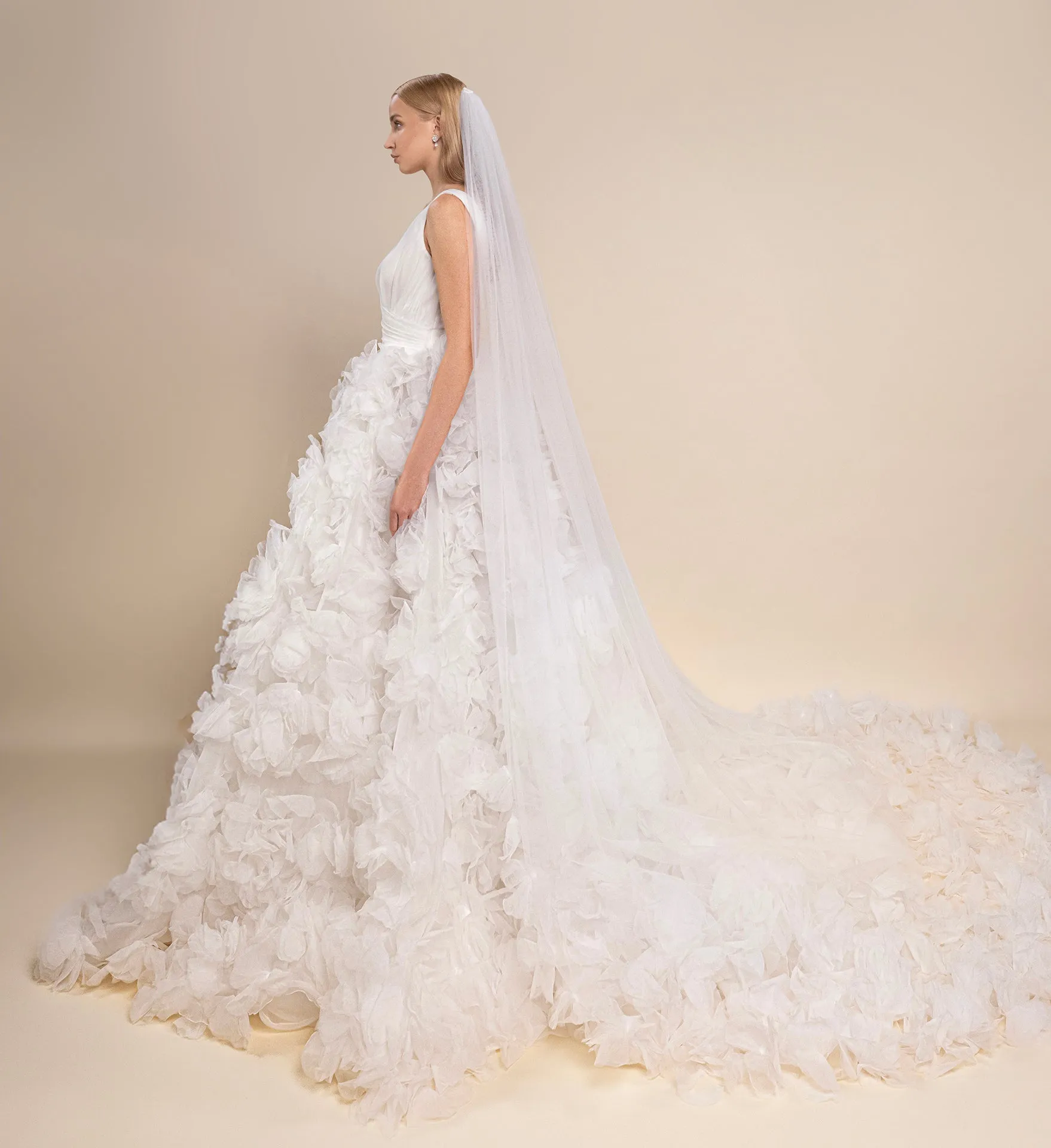 Bridal Gown with V-Neckline, Layered Skirt, Side Slit, and Cathedral-Length Veil